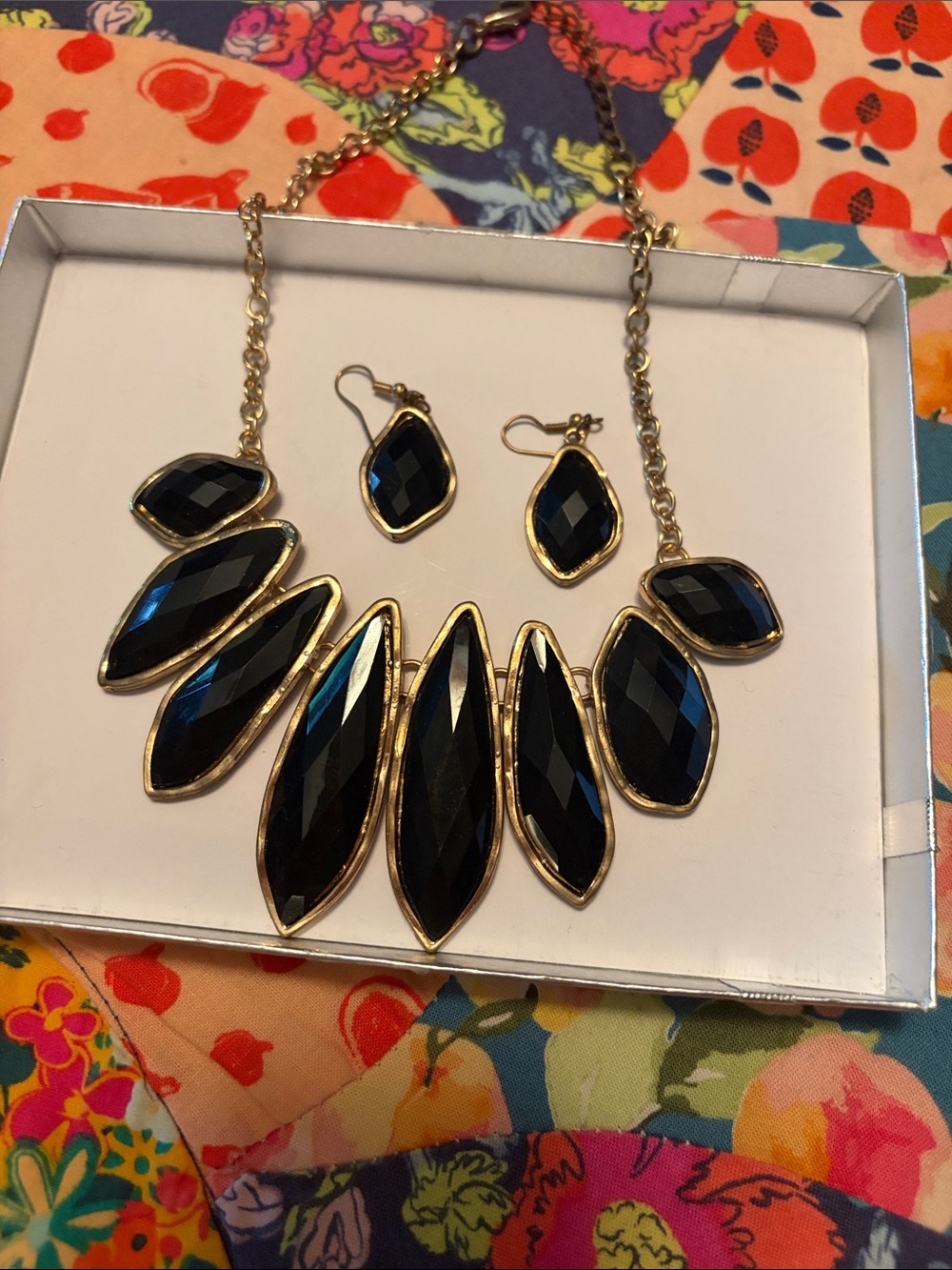 Black earring and necklace pair.